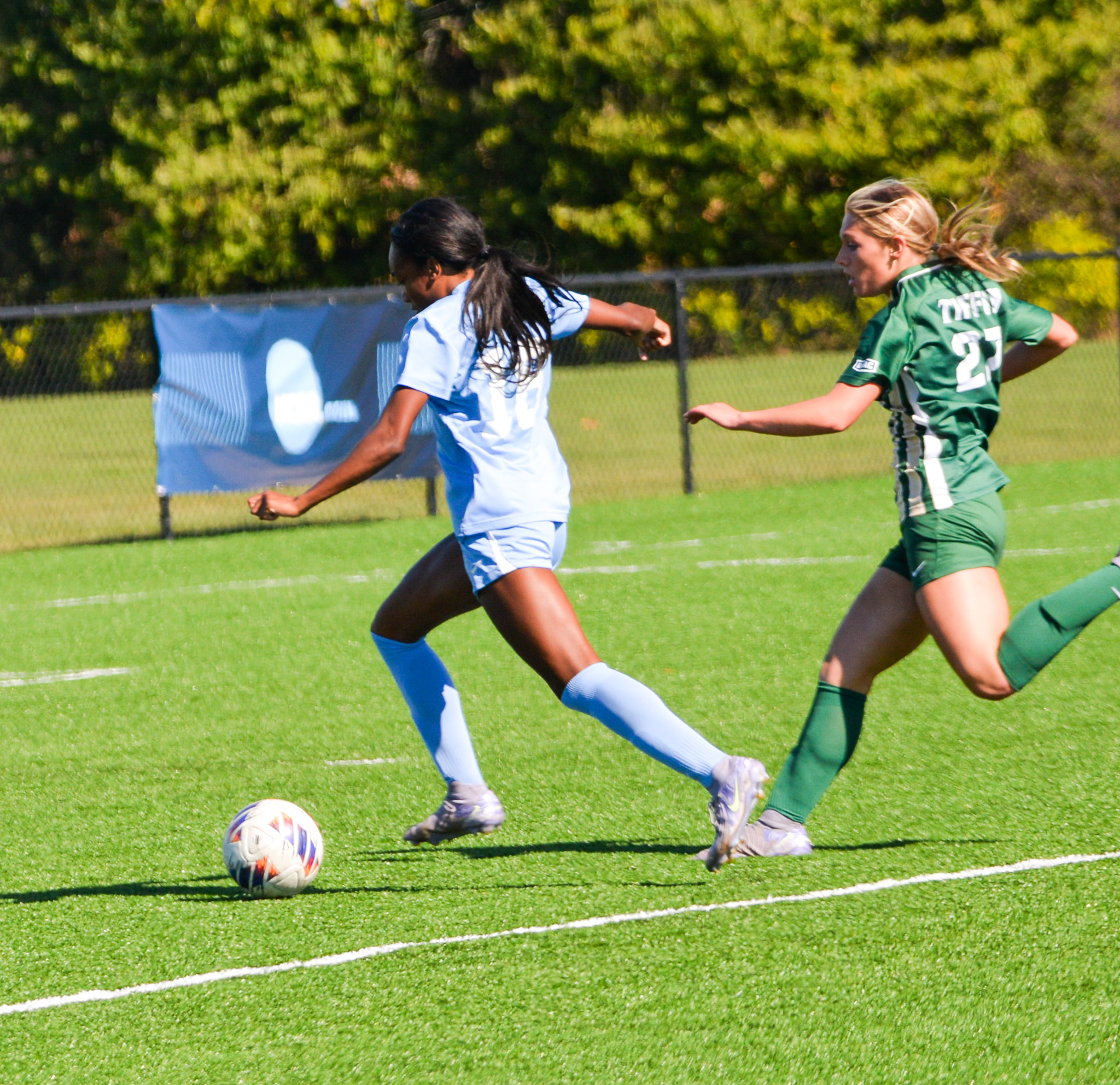 Mari Jackson driving forward with the ball
